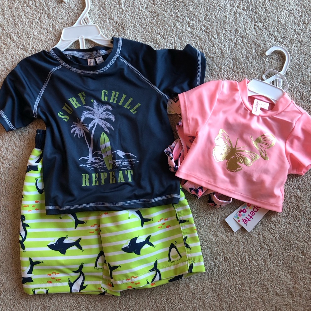 NWT set of boy/girl swimsuits
